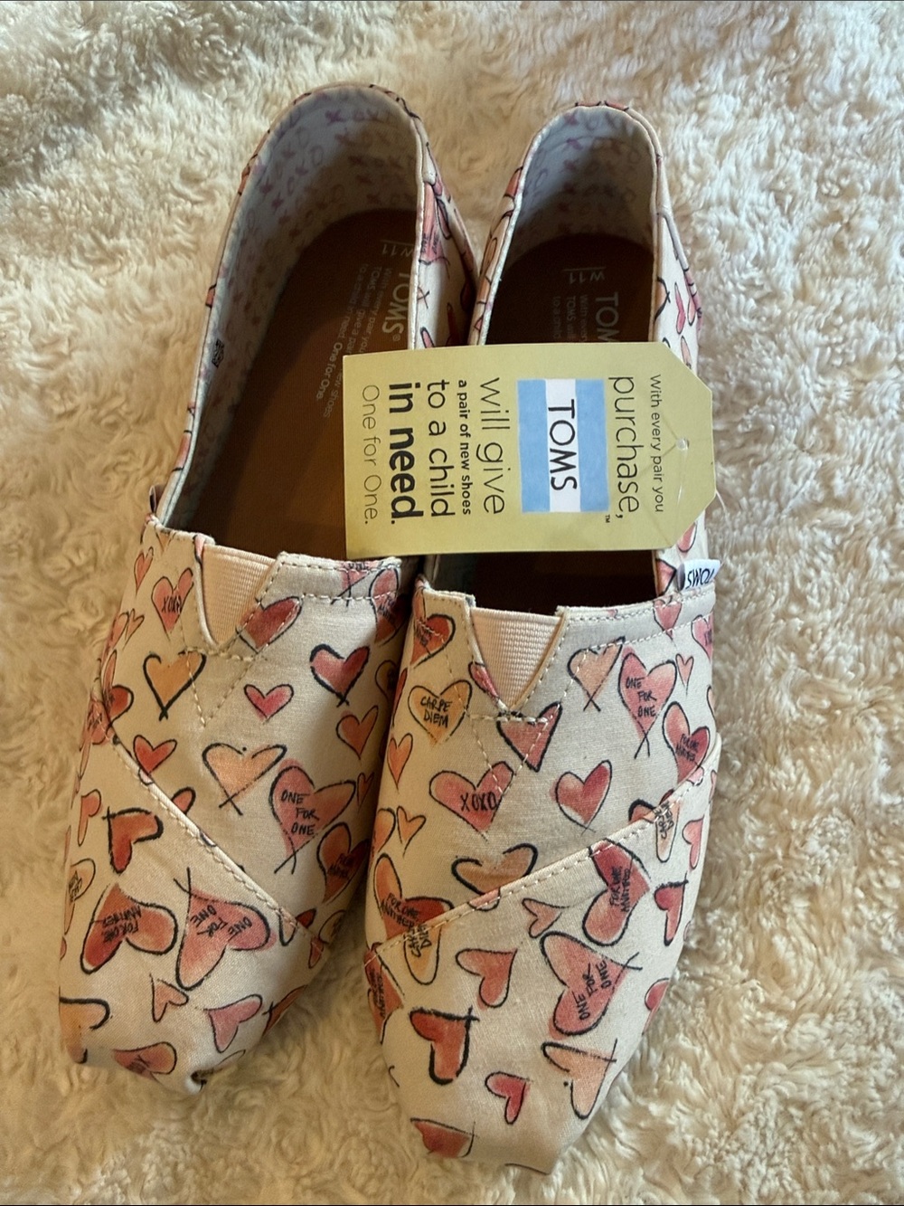 Toms Women's Cream Canvas Slip-Ons with Pink Heart Print
